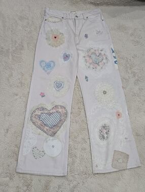 We The Free Pale Pink Flare Jeans with Heart & Lace Imprinted.
